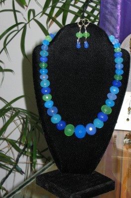 Faceted graduated multi-chalcedony in shades of green and blue with matching earrings.